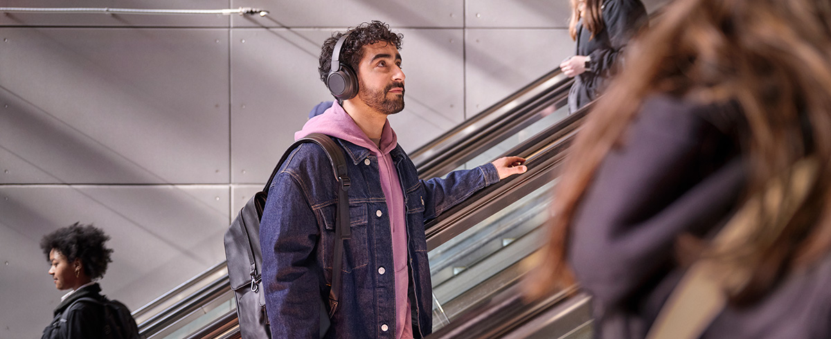 Man wearing Philips noise-cancelling headphones