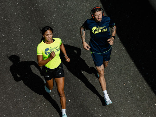 Two runners racing to stay ahead of the capture car.